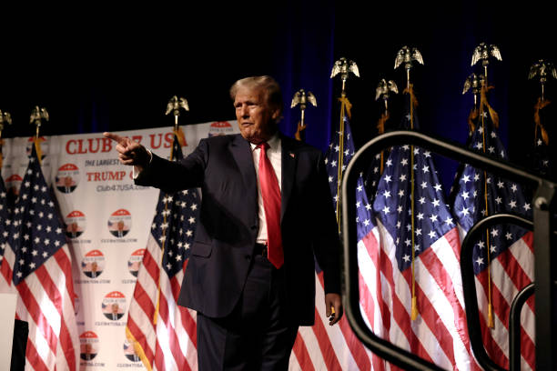 Former U.S. President Donald Trump leaves after delivering remarks at a rally hosted by Club 47 USA at the Palm Beach County Convention Center on...