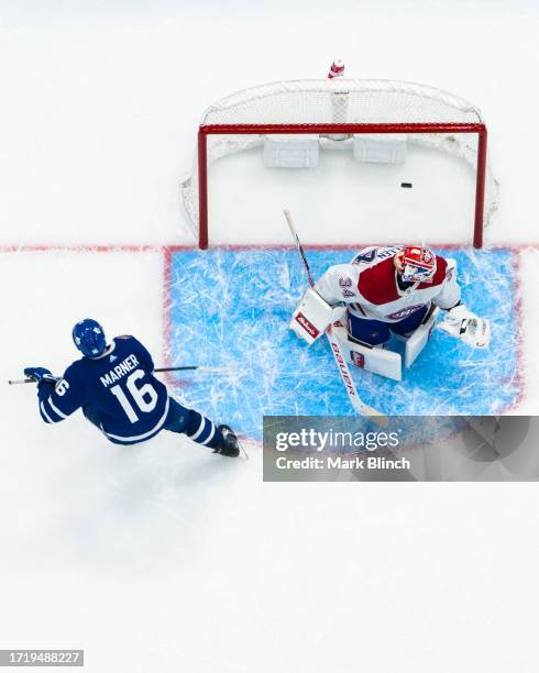 Mitchell Marner of the Toronto Maple Leafs scores a goal in the shootout against the Montreal Canadiens at the Scotiabank Arena on October 11, 2023...