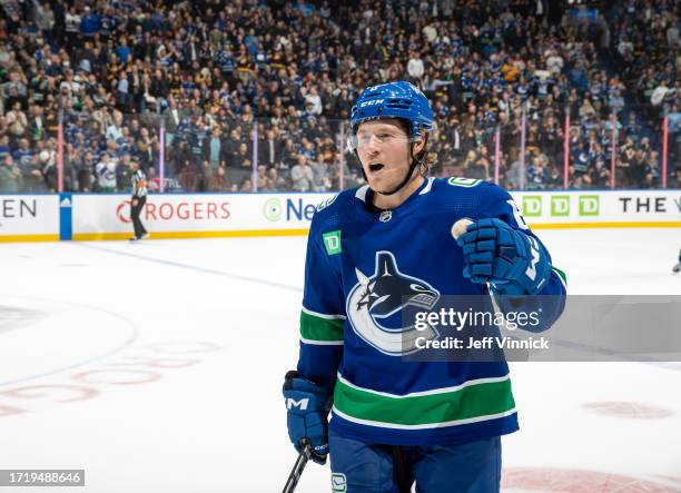 Brock Boeser of the Vancouver Canucks heads to the bench to celebrate his goal during the first period of their NHL game against the the Edmonton...