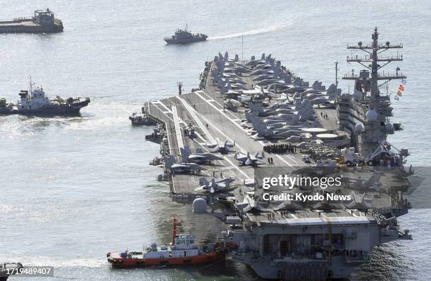 Nuclear-powered aircraft carrier Ronald Reagan docks at the South Korean port of Busan on Oct. 12 amid rising tensions with North Korea.