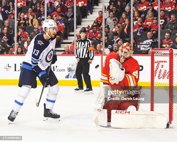 Jacob Markstrom of the Calgary Flames stops a photo from Gabriel Vilardi of the Winnipeg Jets during the second period of an NHL game at Scotiabank...