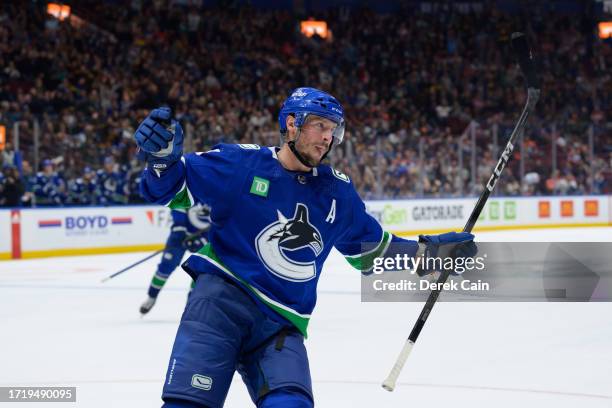 Miller of the Vancouver Canucks celebrates after scoring a goal during the third period of their NHL game against the Edmonton Oilers at Rogers Arena...