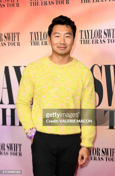 Canadian actor Simu Liu arrives for the "Taylor Swift: The Eras Tour" concert movie world premiere at AMC The Grove in Los Angeles, California on...