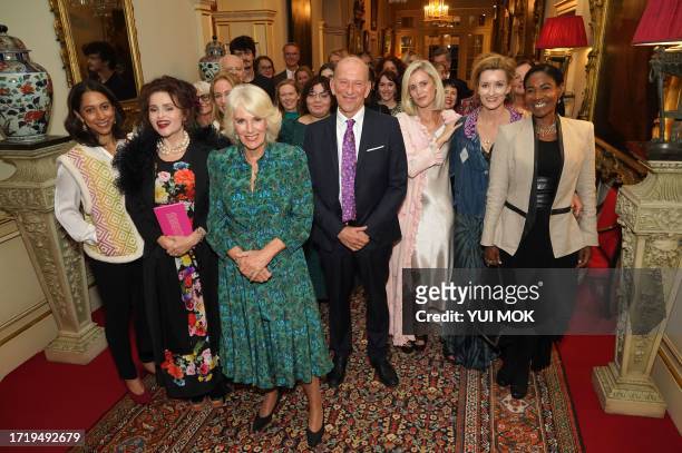 Britain's Queen Camilla poses with Kavita Puri , Helena Bonham Carter , Forward Arts Foundation Founder and CEO William Sieghart , Denise Gough ,...