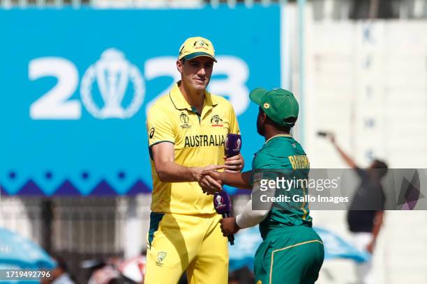 Australia's captain Pat Cummins and Temba Bavuma of South Africa at the toss during the ICC Men's Cricket World Cup 2023 match between Australia and...