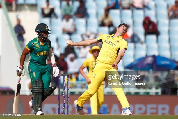 Australia's captain Pat Cummins delivers a ball during the ICC Men's Cricket World Cup 2023 match between Australia and South Africa at BRSABVE...