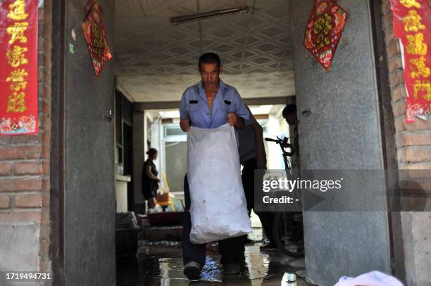 Chinese authorities seize bags of rice dumplings which were made from contaminated rice with sodium cyclamate, an illegal artificial sweetener, at an...