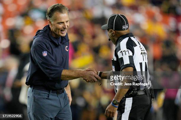 Head coach Matt Eberflus of the Chicago Bears shakes hands with an official prior to the game between the Chicago Bears and the Washington Commanders...