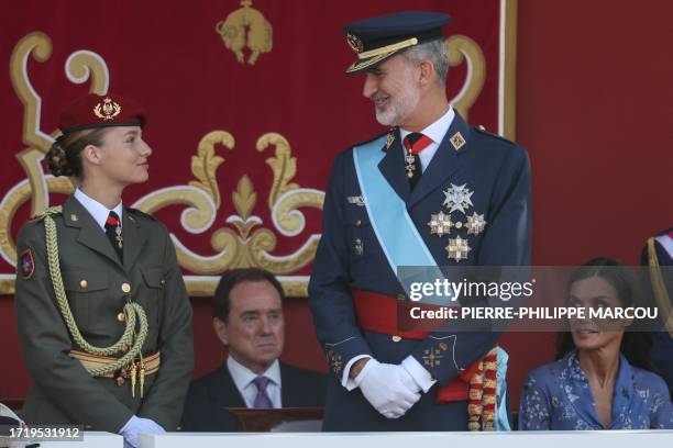 Spanish Crown Princess of Asturias Leonor, Spain's King Felipe VI and Spain's Queen Letizia attend the Spanish National Day military parade in Madrid...