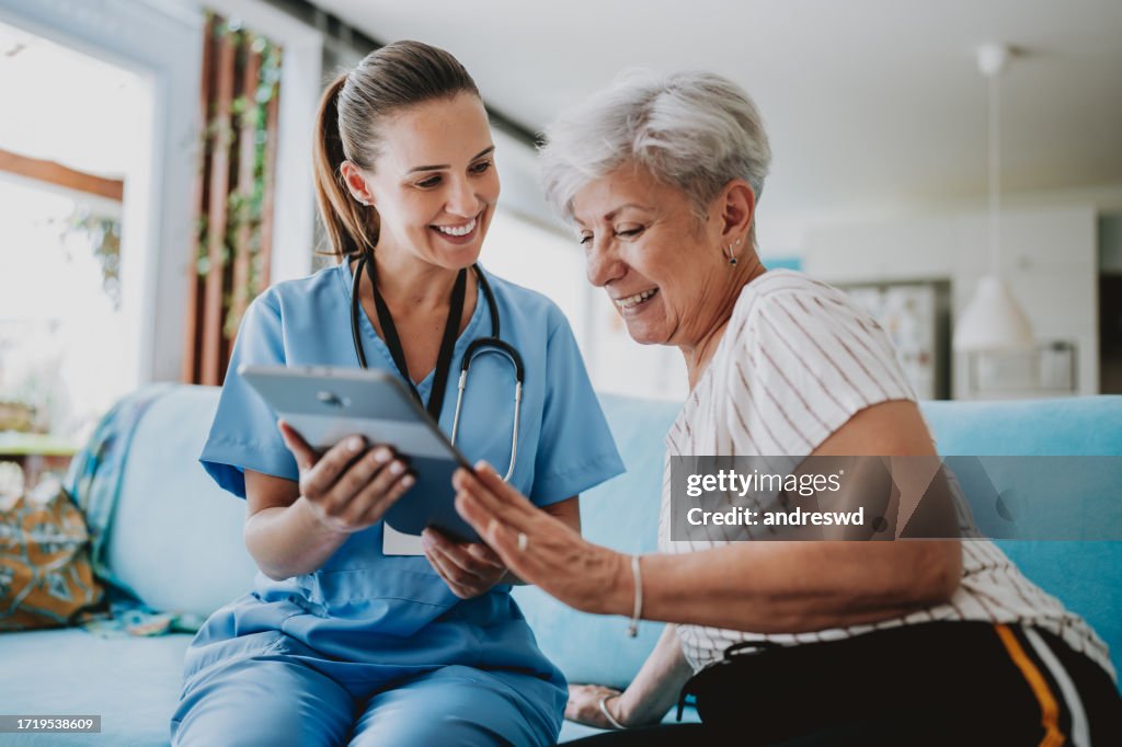 Home care healthcare professional using digital tablet