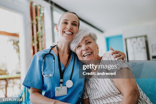 Home care healthcare professional hugging senior patient