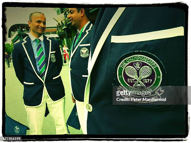Line judges and umpires wait to start work at The Wimbledon Lawn Tennis Championships on June 26, 2013 in London, England.