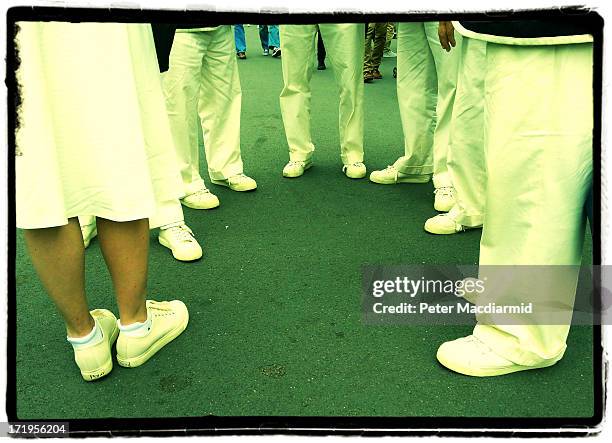 Line judges and umpires wait to start work at The Wimbledon Lawn Tennis Championships on June 26, 2013 in London, England.