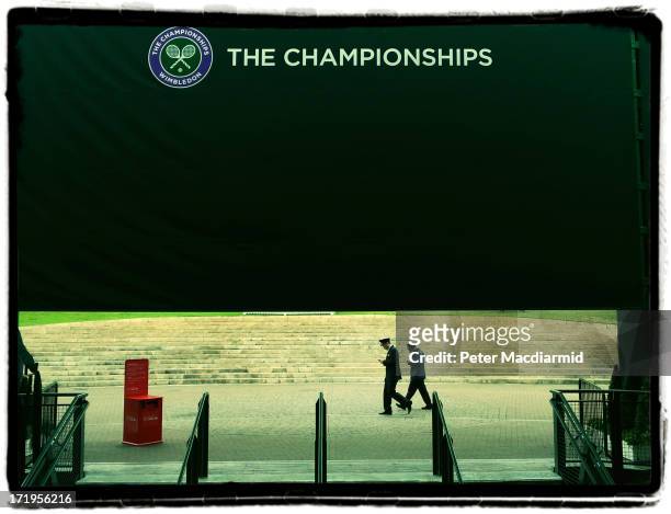 Security guards arrive for work at The Wimbledon Lawn Tennis Championships on June 28, 2013 in London, England.