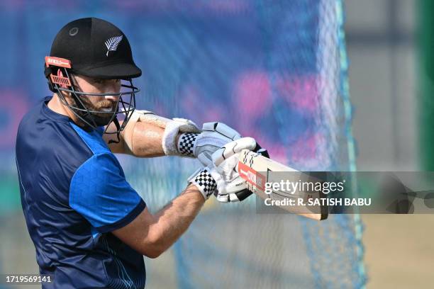 New Zealand's Kane Williamson bats at the nets during a practice session at the M. A. Chidambaram Stadium in Chennai on October 12 ahead of the 2023...