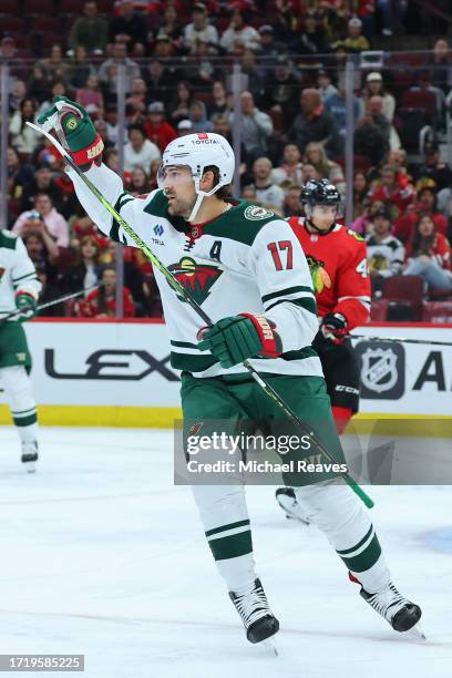 Marcus Foligno of the Minnesota Wild celebrates after scoring a goal against the Chicago Blackhawks during the first period of a preseason game at...