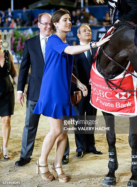 Charlotte Casiraghi and Prince's Albert II of Monaco are seen during the podium ceremony at the 2013 Monaco International Jumping as part of Global...