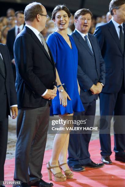 Charlotte Casiraghi and Prince's Albert II of Monaco stand during the podium ceremony at the 2013 Monaco International Jumping as part of Global...