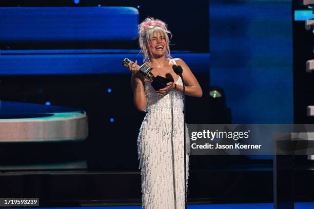 Karol G speaks onstage during the 2023 Billboard Latin Music Awards at Watsco Center on October 05, 2023 in Coral Gables, Florida.