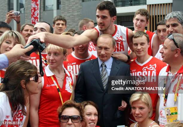 Russian Premier Vladimir Putin meets with members of the Russian National team during his visit at the Olympic village in Beijing, China, on August...