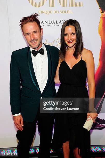 Actor David Arquette and television personality Christina McLarty arrive at the world premiere of 'Michael Jackson ONE by Cirque du Soleil' at...