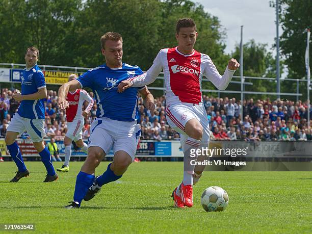Iwan Bos of SDC Putten, Dejan Meleg of Ajax during the pre season friendly match between SDC Putten and Ajax on June 29, 2013 in Putten, The...