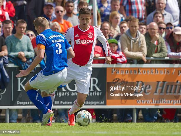 Richard Gooijer of SDC Putten, Dejan Meleg of Ajax during the pre season friendly match between SDC Putten and Ajax on June 29, 2013 in Putten, The...