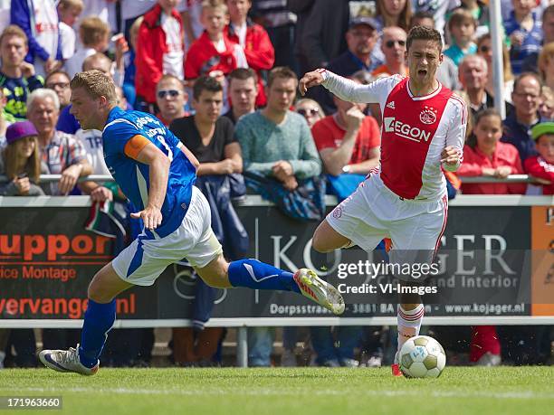 Richard Gooijer of SDC Putten, Dejan Meleg of Ajax during the pre season friendly match between SDC Putten and Ajax on June 29, 2013 in Putten, The...