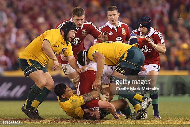 Israel Folau of the Wallabies tackles George North of the Lions during game two of the International Test Series between the Australian Wallabies and...