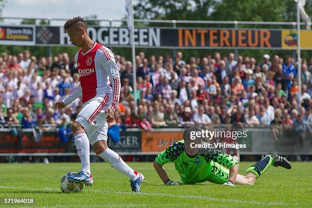 Goalkeeper Rene van Hemel of SDC Putten, Tobias Sana of Ajax during the pre season friendly match between SDC Putten and Ajax on June 29, 2013 in...