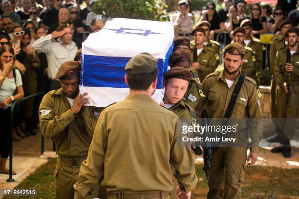 Soldiers carry the coffin of falling soldier, Dor Yarhi, who was killed in a battle with Palestinian militants near the Israeli border with the Gaza...