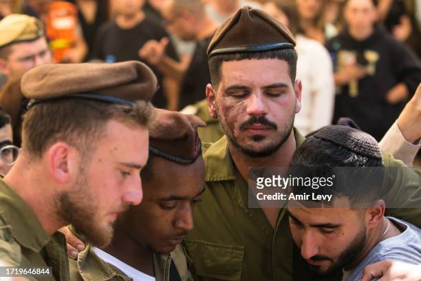 Friends to the 'Golani' unit of fallen soldier, Dor Yarhi, who was killed in a battle with Palestinian militants near the Israeli border with the...