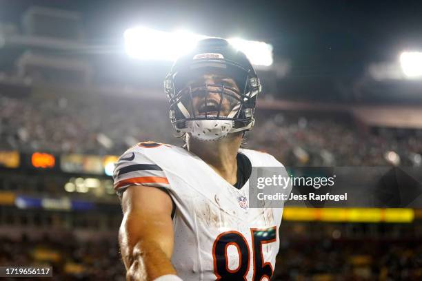 Cole Kmet of the Chicago Bears celebrates scoring a touchdown during the second quarter against the Washington Commanders at FedExField on October...