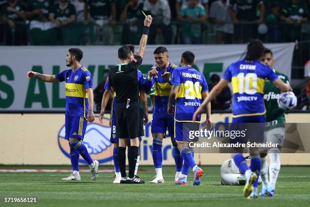 Referee Andres Matonte shows a yellow card to Marcos Rojo of Boca Juniors during the Copa CONMEBOL Libertadores 2023 semi-final second leg match...
