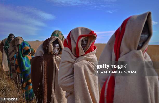 Boys from the Xhosa tribe who have undergone a circumcision ceremony sit near Qunu on June 30, 2013. Qunu is where former South African President...