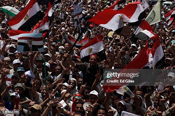 Supporters of Egyptian President Mohammed Morsi chant during a demonstration at the Rabaa al-Adaweya Mosque in the suburb of Nasr City on June 30,...