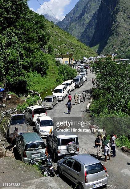 Stranded cars along the river Alaknanda since the day of flash flood as the road to Joshimath has been washed away at Govind Ghat on June 30 2013 in...