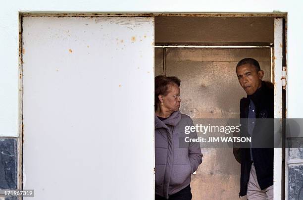 President Barack Obama and his mother-in-law Marian Robinson arrive on June 30, 2013 for a tour of Robben Island where where South-African...