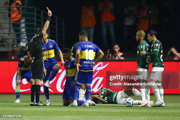 Referee Andres Matonte shows a red card to Marcos Rojo of Boca Juniors during the Copa CONMEBOL Libertadores 2023 semi-final second leg match between...