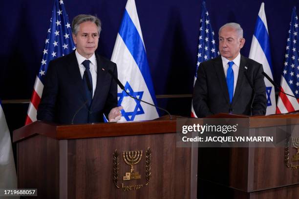 Israeli Prime Minister Benjamin Netanyahu looks on as US Secretary of State Antony Blinken gives statements to the media inside The Kirya, which...