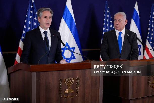 Israeli Prime Minister Benjamin Netanyahu looks on as US Secretary of State Antony Blinken gives statements to the media inside The Kirya, which...