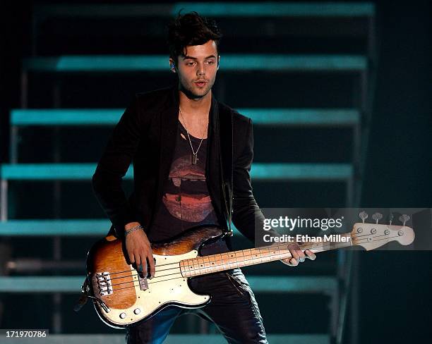 Bassist Ian Keaggy of Hot Chelle Rae performs as the band opens for Justin Bieber at the MGM Grand Garden Arena on June 28, 2013 in Las Vegas, Nevada.