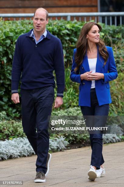 Britain's Catherine, Princess of Wales and Britain's Prince William, Prince of Wales attend a mental fitness workshop run by SportsAid at Bisham...