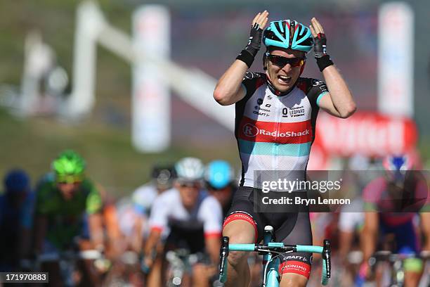 Jan Bakelants of Belgium and Radioshack Leopard celebrates as he crosses the finishing line to win stage two of the 2013 Tour de France, a 156KM road...