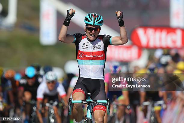 Jan Bakelants of Belgium and Radioshack Leopard celebrates as he crosses the finishing line to win stage two of the 2013 Tour de France, a 156KM road...