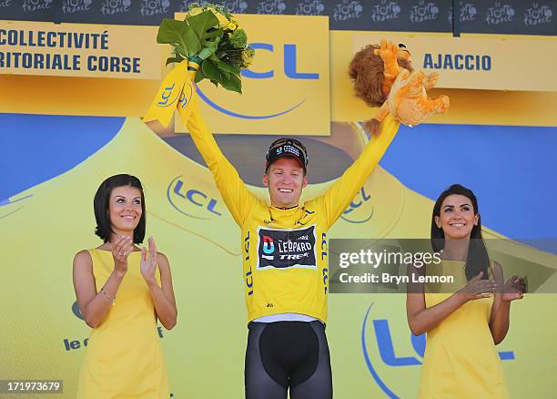 Jan Bakelants of Belgium and Radioshack Leopard celebrates on the podium as he wears the yellow jersey after winning stage two of the 2013 Tour de...