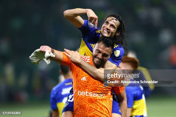 Edinson Cavani of Boca Juniors celebrates with teammate Sergio Romero after winning in the penalty shoot out and advancing to the tournament's final...