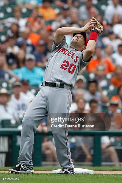 Third baseman Brendan Harris of the Los Angeles Angels catches a fly ball hit by Omar Infante of the Detroit Tigers at Comerica Park on June 27, 2013...