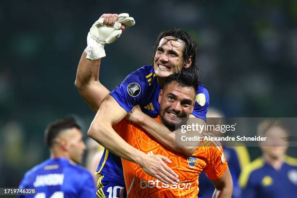 Edinson Cavani of Boca Juniors celebrates with teammate Sergio Romero after winning in the penalty shoot out and advancing to the tournament's final...