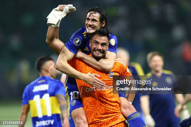 Edinson Cavani of Boca Juniors celebrates with teammate Sergio Romero after winning in the penalty shoot out and advancing to the tournament's final...